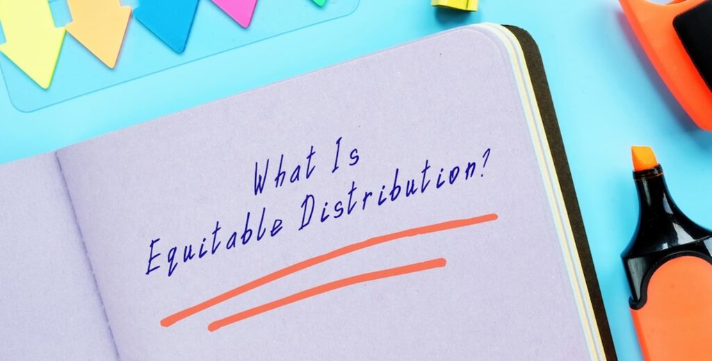 Equitable distribution concept written in notebook explaining fair property division in a Utah divorce