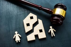 Utah property division in divorce concept with judge gavel and broken house symbol representing marital asset division